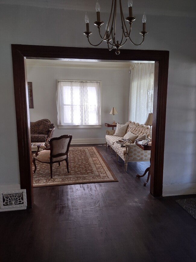 Living Room. The Furniture will be swapped out for new furniture if you want the home furnished. - 2142 S Victoria Ave