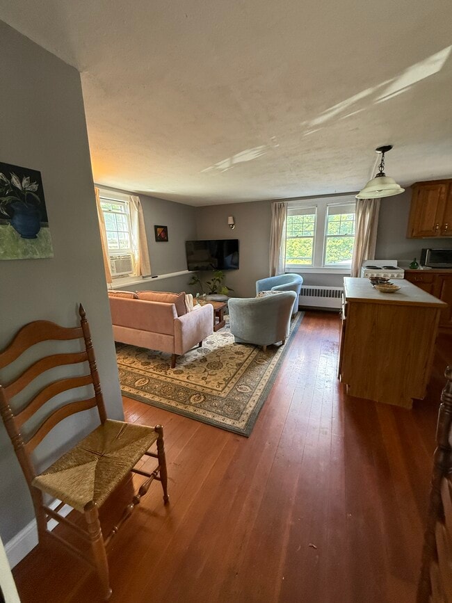 Open floor plan for living room, dining and kitchen - 32 Meadow St