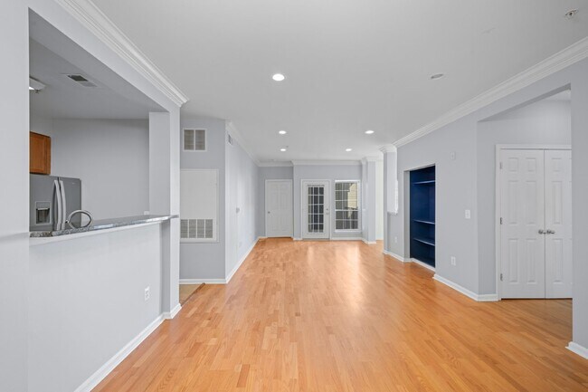 Building Photo - Two-bedroom, two-bathroom model with a den, located on the third floor.