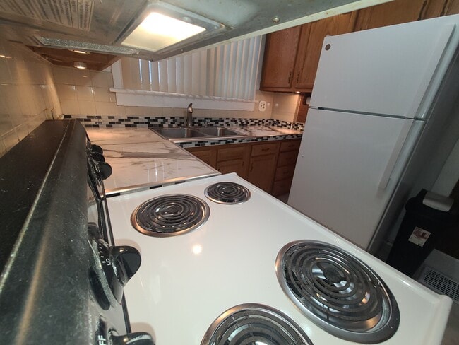 Looking through pass through to kitchen and new quartz countertops - 122 Edgerton Rd