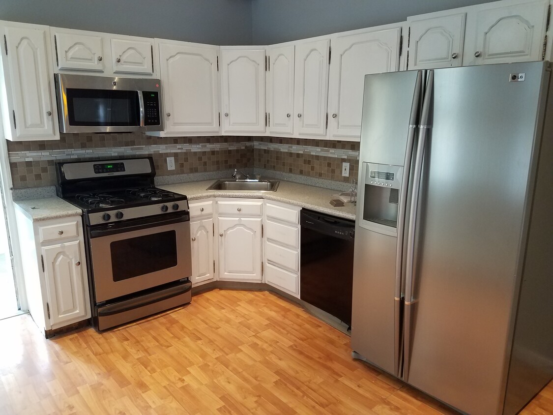 Kitchen with stainless appliances - 2508 E Lehigh Ave