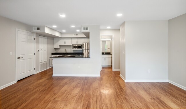 Open living and dining areas with ample natural light - Boulder Creek Apartments