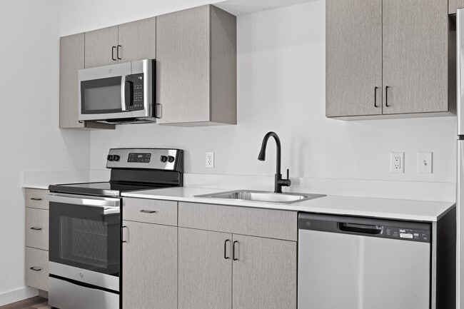 Building Photo - East Line Apartments - Live on Main Street...