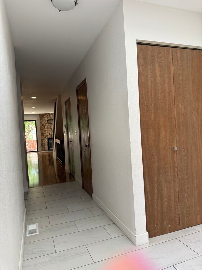 Hall with Main Floor 1/2 Bathroom Door - 7474 E Arkansas Ave