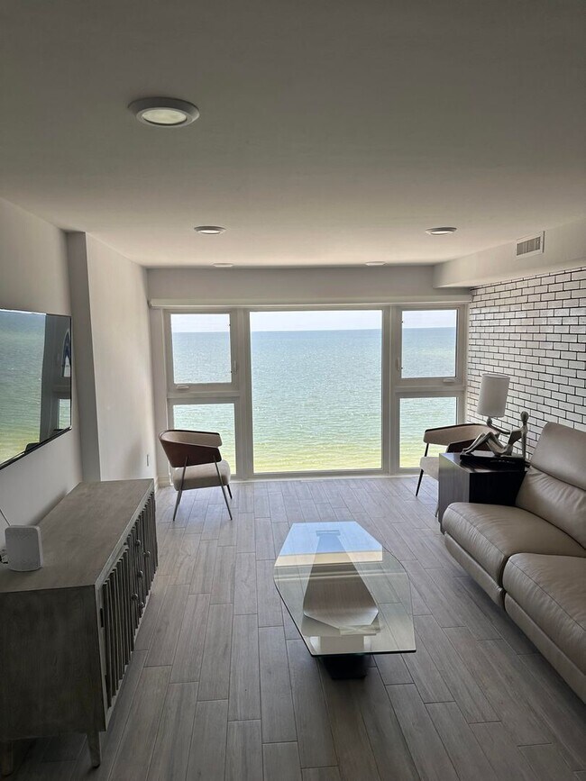 Building Photo - ** STUNNING BEACHFRONT 2/2 PENTHOUSE SEASO...
