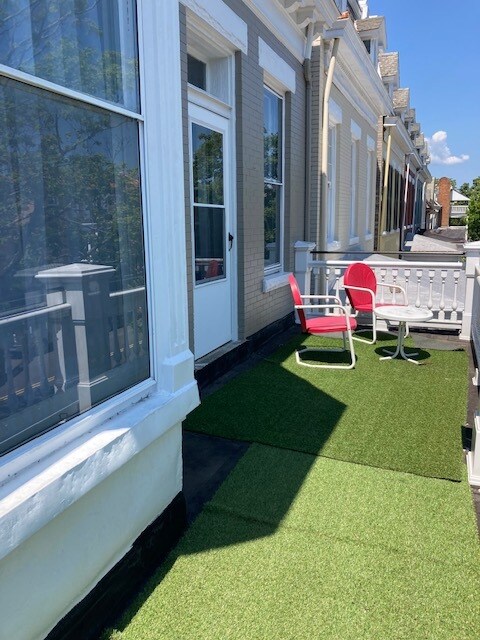 Open front porch accessible from front sitting room - 2713 W Grace St