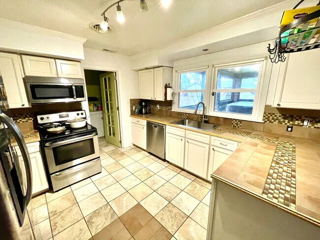 Building Photo - Spacious Home with Large Yard, Hot Tub, and More