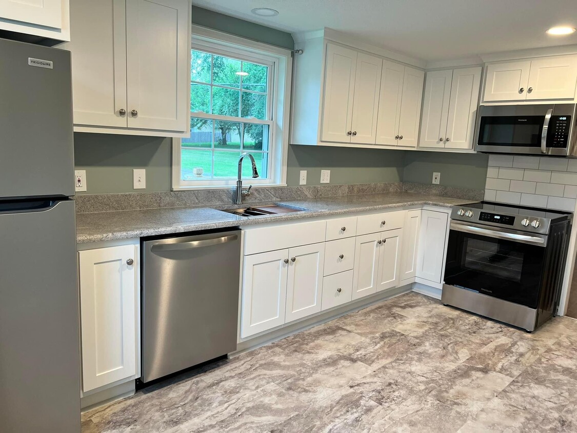 Kitchen with all new stainless appliances - 207 Lynn St