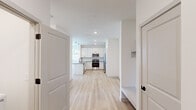 Located at 208 Mountain Creek Dr in Madison, Alabama, this thoughtfully designed one-bedroom, one-bathroom residence offers a clean, modern aesthetic across a single, efficiently arranged floor. Light hardwood-style flooring flows through the main living areas, complementing the crisp white walls and creating a bright, airy atmosphere throughout.

The open-concept kitchen and living area serves as the heart of the home. The kitchen is outfitted with white shaker-style cabinetry, gray countertops, a classic white subway tile backsplash, and a full suite of stainless steel appliances including a range, microwave, and refrigerator. A peninsula with pendant lighting provides additional counter space and connects the kitchen seamlessly to the living area. The living space is filled with natural light from multiple windows and features a ceiling fan and direct access to the outdoors via a glass-paneled door.

The bedroom is a comfortable, well-proportioned retreat finished with plush carpeting, dual windows with blinds that invite natural light, and a ceiling fan overhead. A dedicated closet provides ample storage.

The full bathroom features a tub-shower combination with white tile surround, a white vanity with gray countertop, and matte black fixtures that add a contemporary touch. The home also includes a dedicated closet space for additional storage needs.