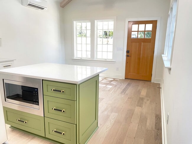 Living room with large windows, ceiling fan - 1216 Forrest Ave