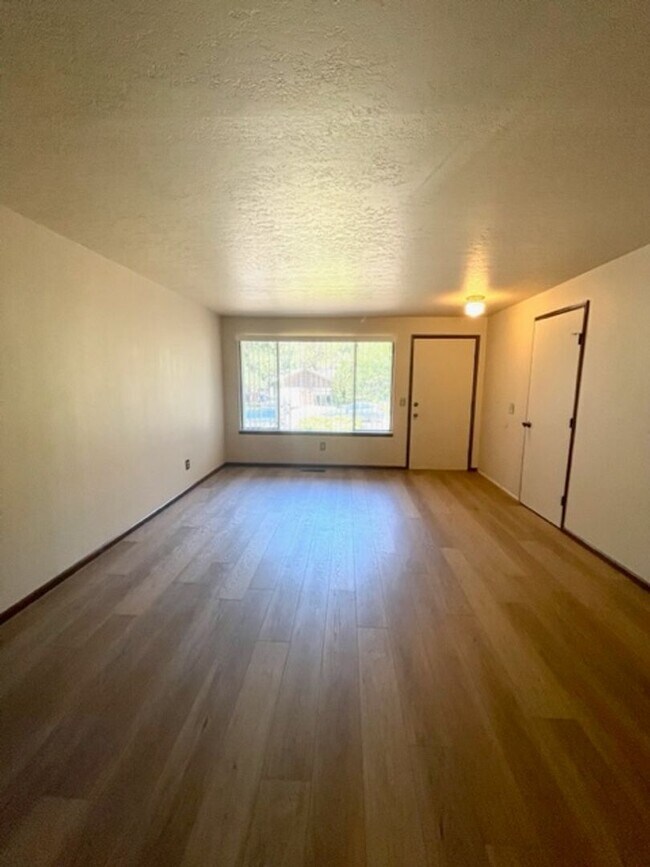 Building Photo - New paint and flooring in this great duple...