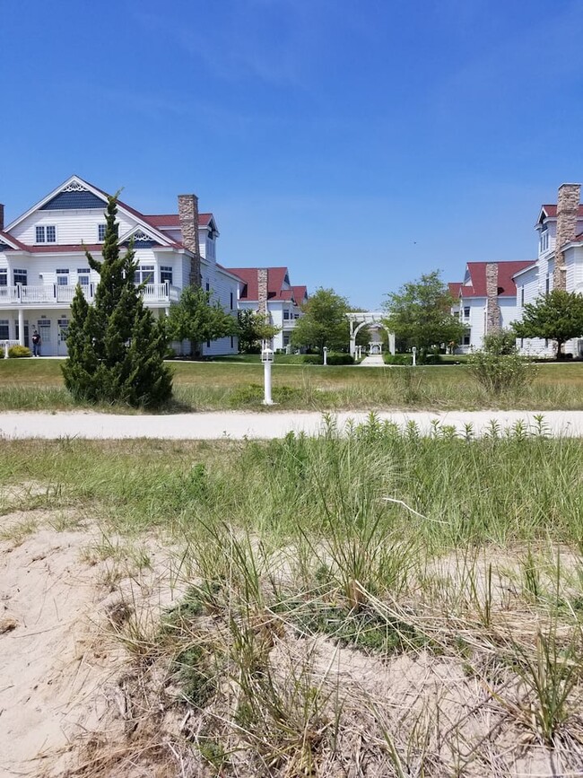 view of villa building from beach - 418 Beachfront Dr