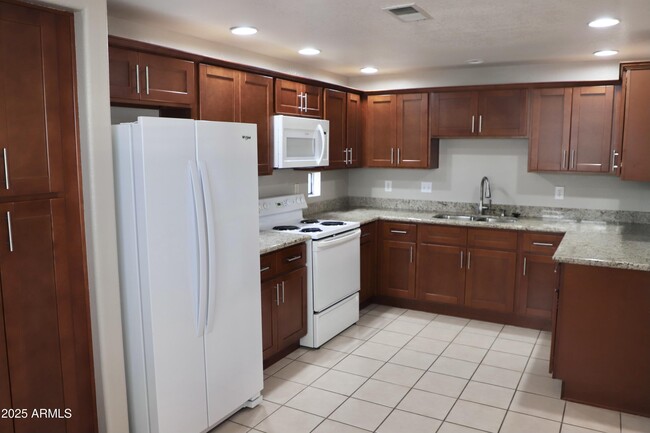 Building Photo - 9555 E Raintree Dr