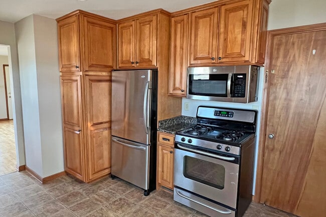 Kitchen - stainless appliance suite with tons of custom cabinetry - 2201 S 73rd St