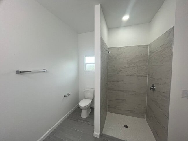 Building Photo - MOVE IN READY & BRAND NEW! Spacious 4 BD/ 2BA/ 2 Car Garage in Lehigh Acres