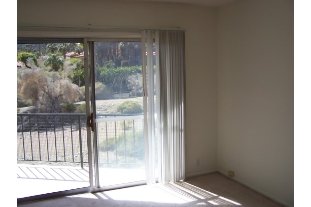 Upstairs interior looking toward balcony - 39950 Bird Ln