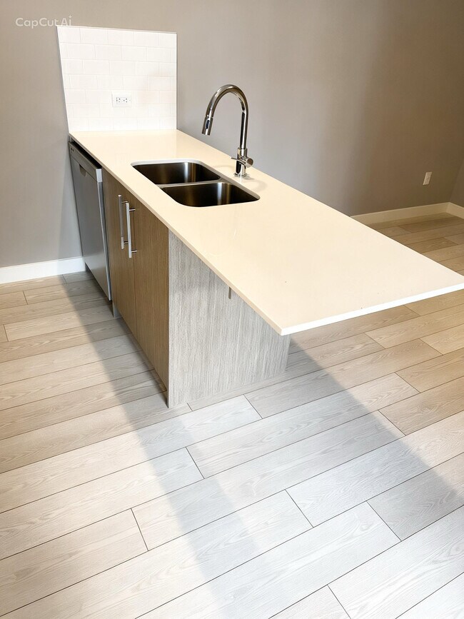 Photo du bâtiment - 310-615 15 Ave SW