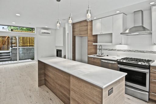 Building Photo - AVAILABLE AUGUST 14th! Modern Townhome w/ Private Balcony, AC, & Reserved Parking in Central Area