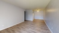 Located at 950 Buena Vista St in Amarillo, Texas, this single-floor, two-bedroom, one-bathroom unit offers a well-organized layout across a comfortably sized floor plan. The living room features light wood-look vinyl flooring, a textured accent wall, and a sliding glass door with vertical blinds that opens to an outdoor patio, allowing natural light to fill the space. Adjacent areas continue the wood-look flooring, maintaining a cohesive, clean aesthetic throughout the common spaces. The primary bedroom is generously proportioned, featuring soft carpeting, a ceiling fan, and a walk-in closet equipped with dual hanging rods on both sides — providing ample storage. The second bedroom also features carpet flooring, a ceiling fan, and a window with blinds that brings in natural light. Both bedrooms are finished in neutral tones, offering a versatile backdrop. The bathroom includes a full soaking tub with white tile surround, wood-look flooring, and a vanity with dark cabinetry. A dedicated closet adds additional storage to the unit. The overall design is practical and neutral, with consistent finishes throughout that create a clean, move-in-ready environment.