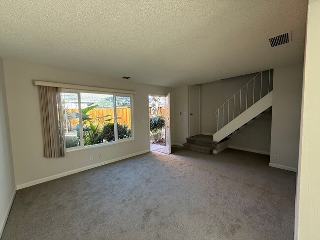 Building Photo - Quiet unit with new paint, new carpet, new windows and Air Conditioning!