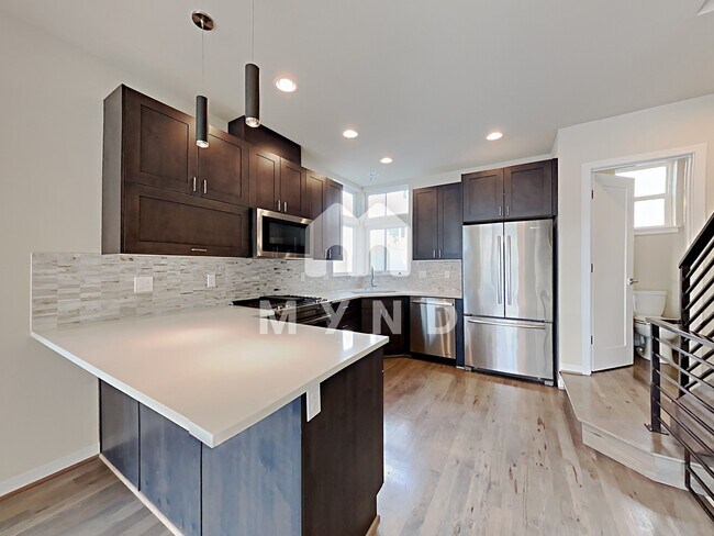 Building Photo - 3936 1st Ave NE Unit A