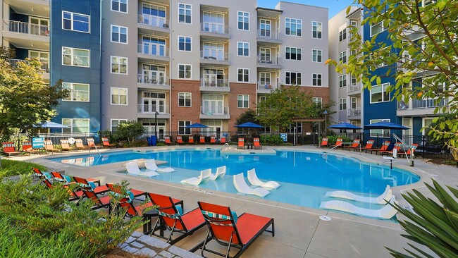 Resort-style swimming pool with cabanas - AMLI Buckhead