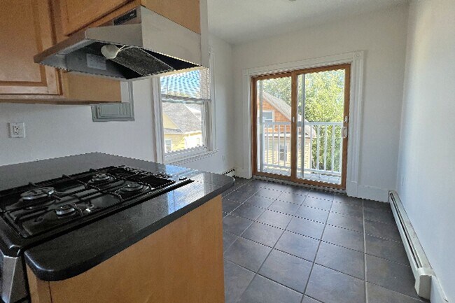 Photo - 9/1 Renovated, spacious 4BR/2.5BA w/d in unit! Apartment