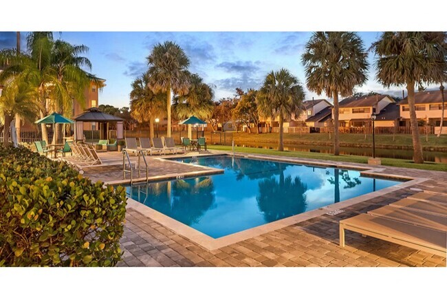 Relax poolside at Midora at Woodmont in Tamarac, FL - Midora at Woodmont