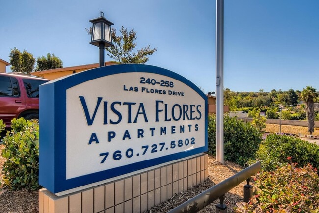 Letrero del monumento de los apartamentos Vista Flores - Vista Flores Apartments