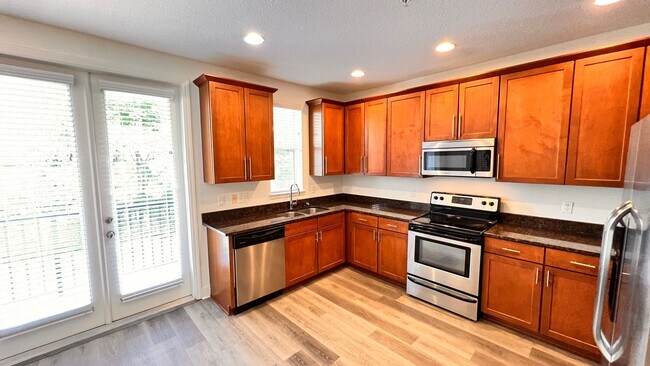 Building Photo - Welcome to Your Three-Story Paradise in Th...