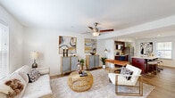 Located at 511 Burhans Blvd in Hagerstown, Maryland, this two-floor residence offers a thoughtfully designed layout with a warm, contemporary aesthetic throughout. The main living area is bright and open, featuring light hardwood-style flooring, a ceiling fan, and natural light filtering through window blinds. The space flows seamlessly into a dedicated dining area, which benefits from a large window with vertical blinds and connects naturally to the rest of the main floor.

The kitchen is well-equipped with rich, dark wood cabinetry, stainless steel appliances including a refrigerator, microwave, and range, complemented by a light-toned countertop island that adds both prep space and visual contrast. Recessed lighting illuminates the kitchen efficiently.

The bathrooms feature matching dark wood vanities with white countertops, large mirrors, and hardwood-style flooring, maintaining a consistent design language. A separate water closet provides added privacy and convenience.

The bedrooms are carpeted for comfort and feature neutral white walls with windows that allow natural light and outdoor views. The clean, understated palette of the bedrooms offers versatility for a range of uses. Overall, the residence presents a cohesive, modern interior with consistent finishes across both floors.
