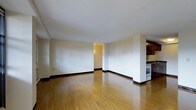 Located at 300 Tresser Blvd in the heart of Stamford, Connecticut, this three-bedroom, one-bathroom residence offers a well-designed single-floor layout with a private balcony. The open-concept living and dining area is bright and airy, featuring warm hardwood flooring that runs throughout, crisp white walls, and clean architectural lines that create an inviting, versatile living space. The kitchen is positioned adjacent to the main living area and is equipped with dark wood cabinetry, built-in appliances including an oven, and ample counter space, making it both functional and efficient. A wide entryway connects the living space to the rest of the home, offering a natural flow between rooms. The three bedrooms provide comfortable accommodations, while the balcony extends the living space outdoors, offering a private retreat for relaxing or entertaining. The overall ambiance of the residence is clean, modern, and move-in ready, with neutral tones and durable finishes throughout. Situated in downtown Stamford, residents benefit from convenient access to local dining, shopping, public transportation, and major commuter routes.