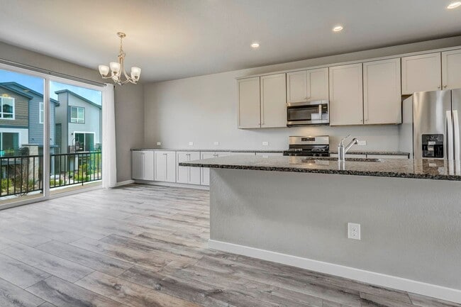 Building Photo - Modern 4BR with Open Kitchen, Patio & 2-Car Garage