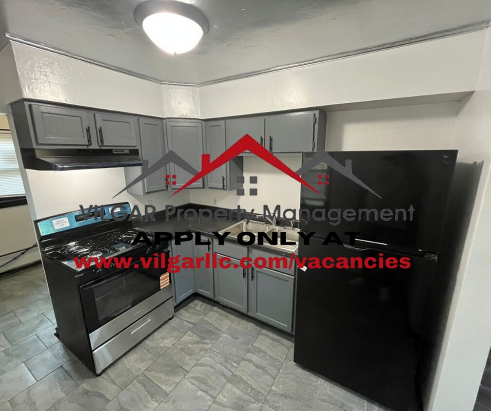 Foto principal - This keen & clean 2 bed / 1 bath ranch-sty...