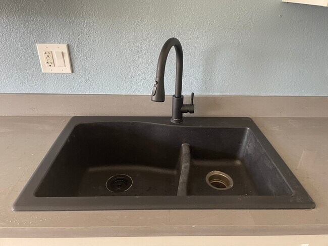Newly installed 33" granite double sink. - 828 32nd St