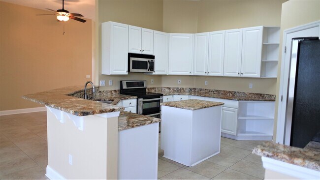 Building Photo - Fall Head Over Heels for this 4 bedroom, 3...