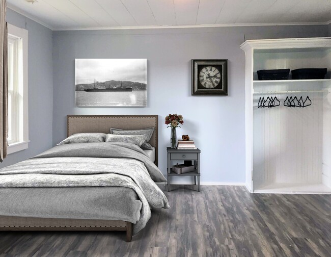 Master bedroom with natural light, useful open built-in storage, and tons of arrangement options. - 886 1/2 E Mulberry St