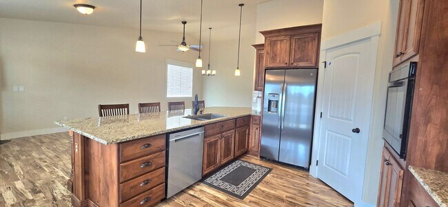 Building Photo - THREE-CAR GARAGE! This charming home offers 3 bedrooms, plus an office/rec room, and 2 bathrooms.