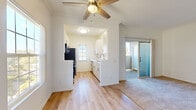 Located at 455 Dennery Rd in San Diego, CA, this single-floor, 3-bedroom, 1-bathroom home offers a clean and functional layout designed for comfortable everyday living. The galley-style kitchen is a standout feature, equipped with stainless steel appliances including a gas range, microwave, and refrigerator, complemented by white cabinetry, light quartz countertops, a stainless steel sink, and light hardwood-style flooring. A charming arched window brings in natural light, enhancing the bright and airy atmosphere. The living area connects seamlessly to the kitchen and features a ceiling fan, crown molding, and a mix of hardwood-style and carpeted flooring. The spacious primary bedroom offers generous room, with carpet flooring and access to a dedicated closet with sliding mirrored doors. The two additional bedrooms are well-proportioned, carpeted, and filled with natural light through windows fitted with vertical blinds. The shared full bathroom is clean and straightforward, featuring a tub-shower combination with a curved curtain rod and hardwood-style flooring. A hallway connects all rooms efficiently, completing this well-organized and move-in-ready home.