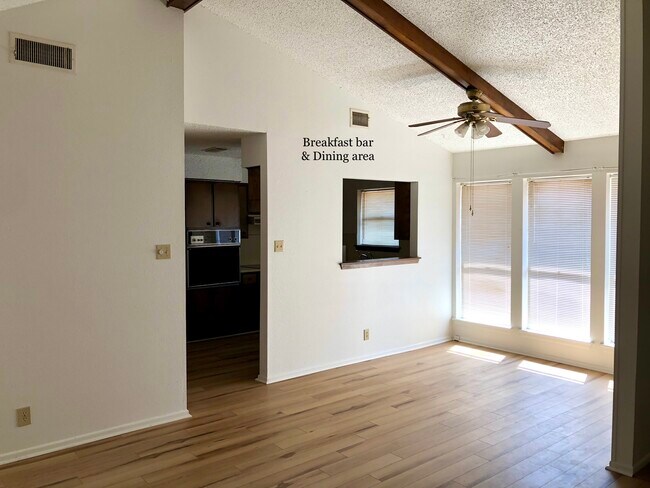 Kitchen’s Breakfast Bar opens into Dining Area - 6428 Amber Dr