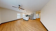 Located at 4591 McRee Ave in St. Louis, MO, this well-appointed 3-bedroom, 2-bathroom home offers a thoughtfully designed single-floor layout with modern finishes throughout. The open-concept living and kitchen area serves as the heart of the home, featuring warm luxury vinyl plank flooring, a ceiling fan, and natural light from large windows with blinds. The kitchen is a standout, boasting white shaker cabinetry with matte black hardware, quartz countertops, a central island, stainless steel appliances, a deep undermount sink, and a striking teal subway tile backsplash — all complemented by pendant lighting. A clean, well-lit hallway connects the living spaces to the private quarters. The primary bedroom is generously sized, with a ceiling fan and a glass-paned door leading to a private balcony overlooking the neighborhood. The additional bedrooms each offer natural light through large windows and consistent vinyl plank flooring. The two bathrooms are finished in a clean, contemporary style — one features a frameless sliding glass shower with white tile and matte black fixtures, while the second includes a white vanity, quartz countertop, and coordinating black hardware. A dedicated closet provides additional storage, completing this cohesive and modern living space.