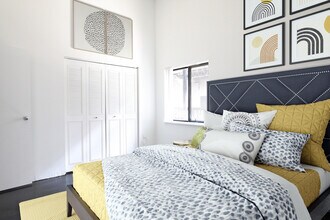 Courtyard Bedroom Yellow Bed - Ford Factory Lofts