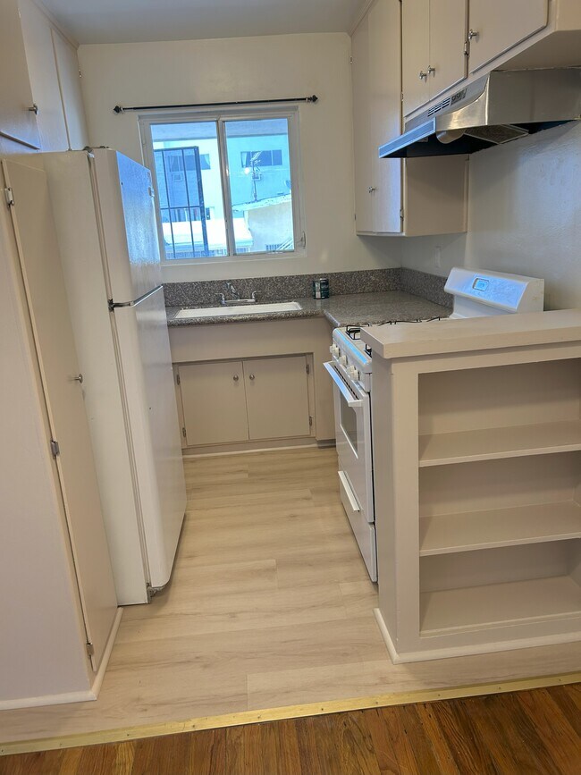 New Kitchen Floor - 7704 Romaine St