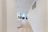 Located at 102 Hackett Blvd in Albany, NY, this thoughtfully designed 2-bedroom, 2-bathroom residence offers a bright, modern living experience across a single floor. The open-concept layout seamlessly connects the kitchen and living room, creating a spacious and cohesive common area. The living room is a standout, featuring soaring ceilings, elegant arched windows that flood the space with natural light, and light-toned hardwood flooring that runs throughout. The kitchen is well-appointed with crisp white shaker cabinetry, a striking marble-veined quartz waterfall island with an undermount sink, stainless steel appliances including a gas range and French door refrigerator, and stylish globe pendant lighting. Both bedrooms are comfortably sized, each with closet storage; the primary bedroom includes a dedicated wall-mounted HVAC unit for personalized climate control. The bathrooms feature clean, contemporary finishes, with one showcasing a glass-enclosed walk-in shower with classic white subway tile. A dedicated in-unit laundry room with a full-size washer and dryer adds everyday convenience. The overall aesthetic is clean, modern, and move-in ready.
