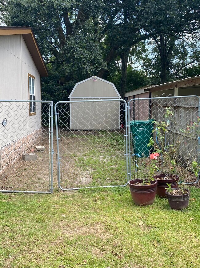 Entry to backyard with shed - 204 Romero St