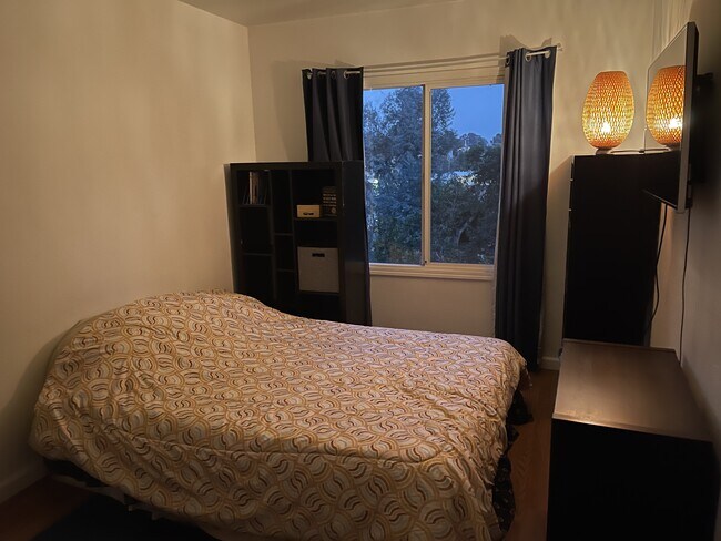 First bedroom (furnished) with view of Sausal Creek. - 20 Peroly Ct