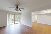 Located at 7 Prism Place in Gaithersburg, MD, this well-appointed single-floor residence offers three bedrooms, two bathrooms, and a thoughtfully designed layout. The open living room features warm hardwood-style flooring, a ceiling fan with light fixture, and sliding glass doors that lead to a private balcony with lush tree views, filling the space with abundant natural light. The adjacent dining area flows seamlessly into the living space, creating a connected and functional common area. The kitchen is equipped with stainless steel appliances — including a gas range, microwave, dishwasher, and refrigerator — complemented by warm wood cabinetry, dark countertops, and a window overlooking the outdoors. The primary bedroom is generously sized with hardwood-style flooring, a ceiling fan, and ample closet space. Additional bedrooms feature plush carpeting and large windows that bring in natural light and outdoor views. The bathrooms are clean and functional, with wood-tone vanities and large mirrors. A dedicated laundry room, utility room, pantry, and seven closets throughout provide exceptional storage. With two hallways connecting the space and a private balcony, this residence offers both comfort and practicality in a convenient Gaithersburg location.