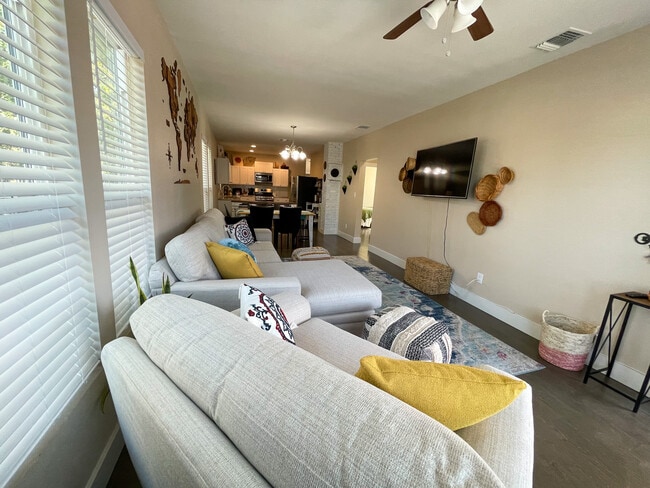 Loving room showing wall mounted TV. - 422 S Olive St House