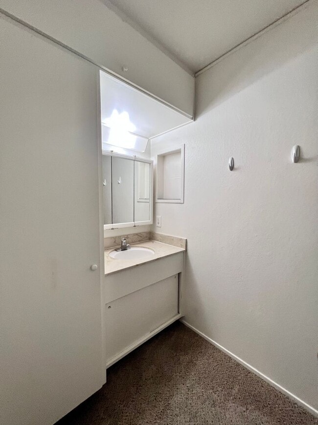 Building Photo - Cozy 1 bedroom on lush courtyard includes water / garbage & 1 parking spot.