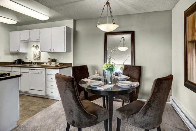 Dining area with overhead lighting and easy access to the kitchen - Arrive Magnolia